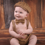 Cute infant with a bowtie on. From Enlightened Photography.